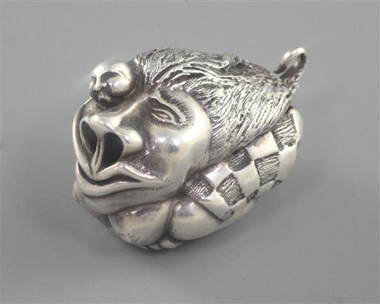 A Japonaise silver miniature netsuke style figural group of a stylised lion with figure, 45mm.